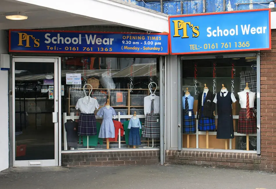 Shop front sign and window display of clothing for PTs school wear