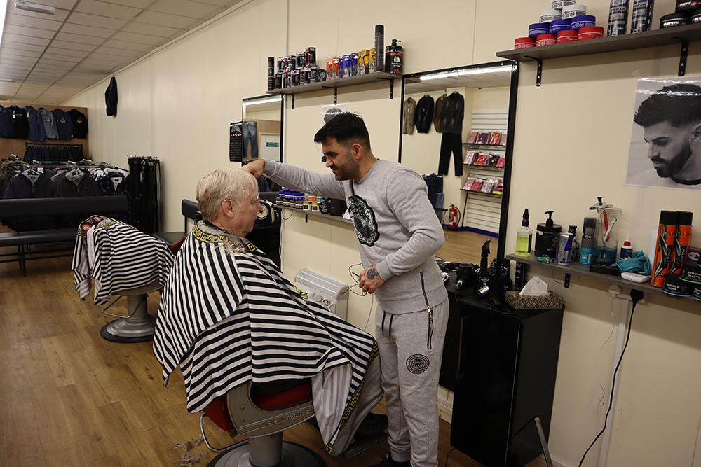 A person cutting a person's hair