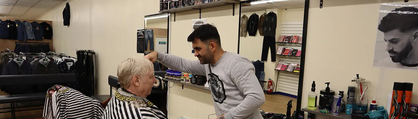 A person cutting a person's hair